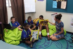 Students reading books in classroom